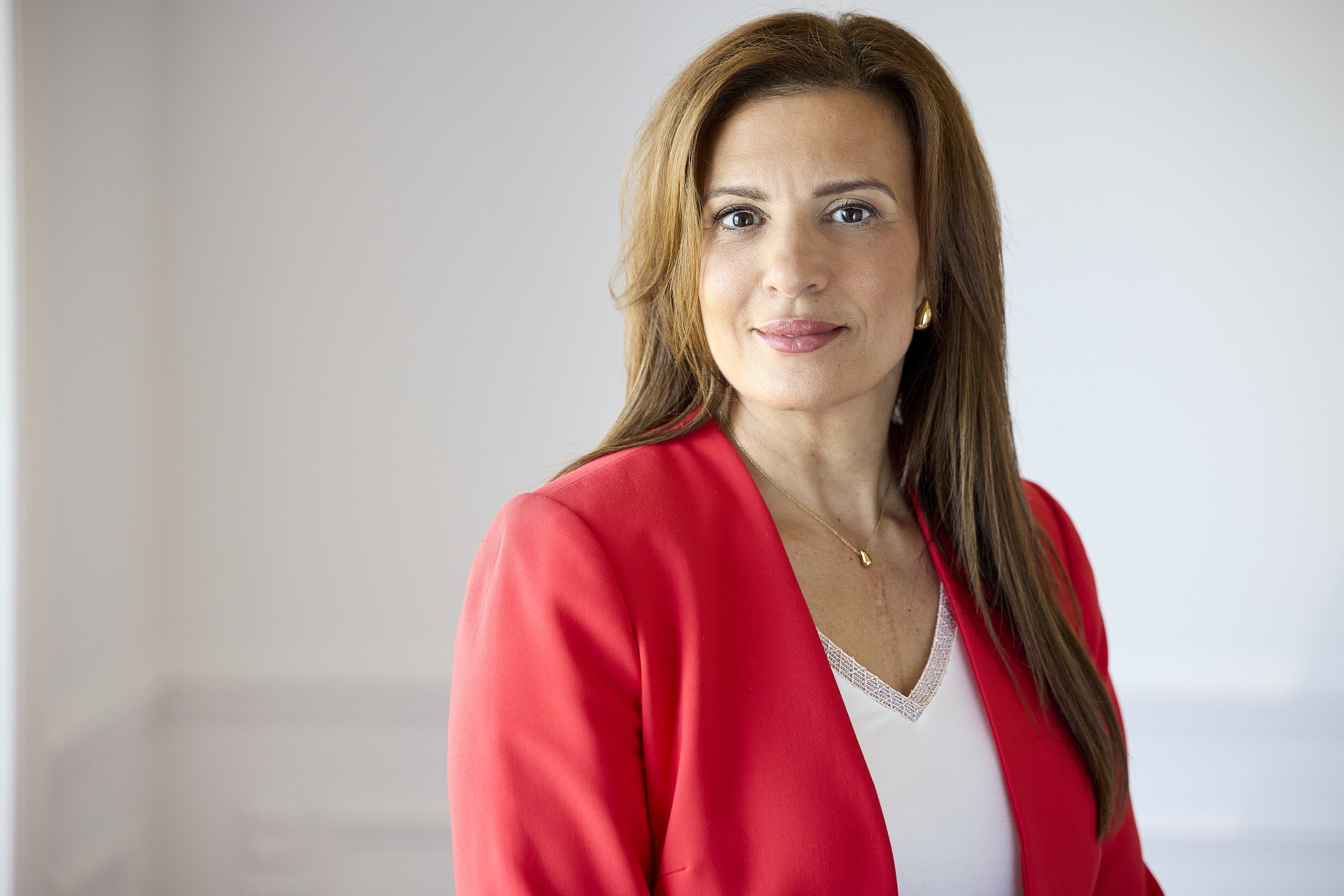 Marie-Dominique Taillon — portrait in a red blazer